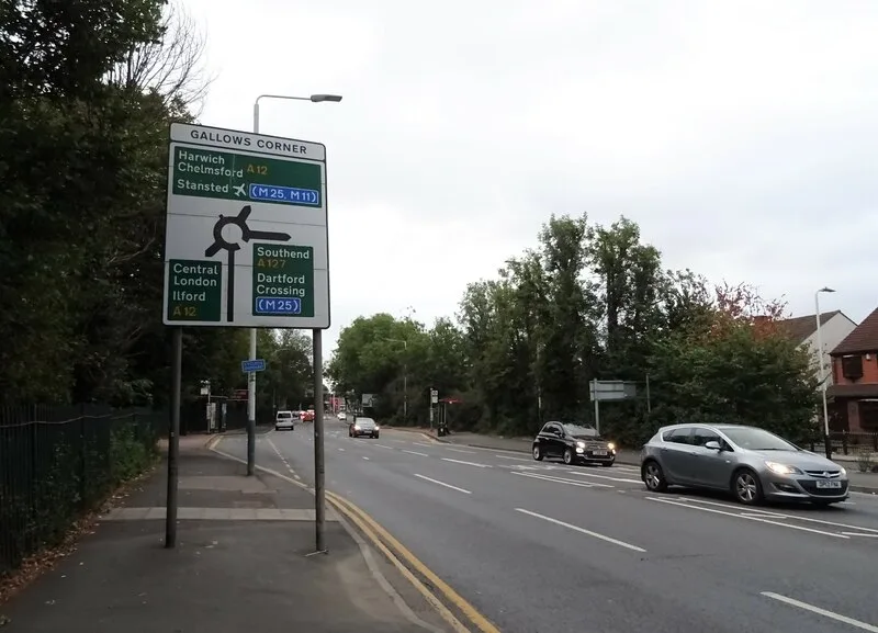 The Gallows Corner sign gantry on the approach to the roundabout, photographed in 2022