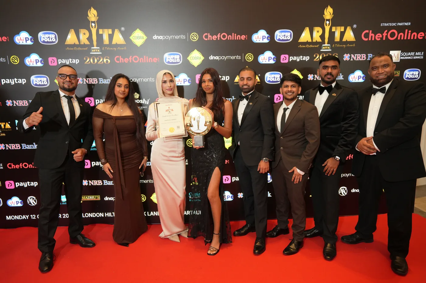 The Kaani Kaana team with the National Takeaway of the Year trophy and certificate at the London Hilton on Park Lane.