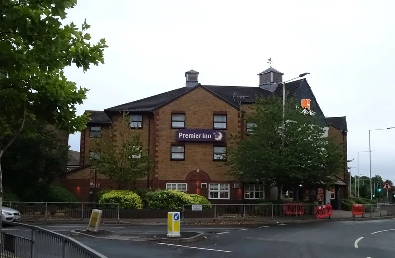 The Premier Inn at Mercury Gardens in August 2022, with the Liberty Bell Beefeater sign on the right of the building